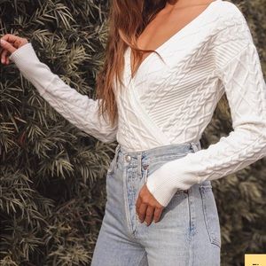 Lulu’s “Got My Attention White Cable Knit Surplice Sweater”